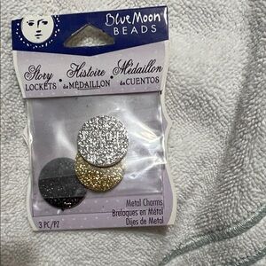 Silver, Gold, and Black Metal Charms